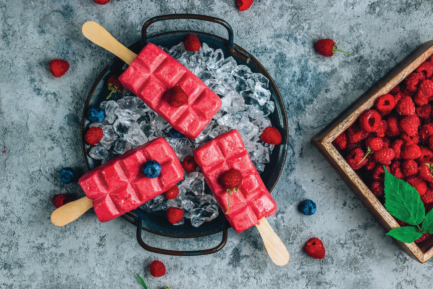 Homemade raspberry popsickles are a win-win summer treat.